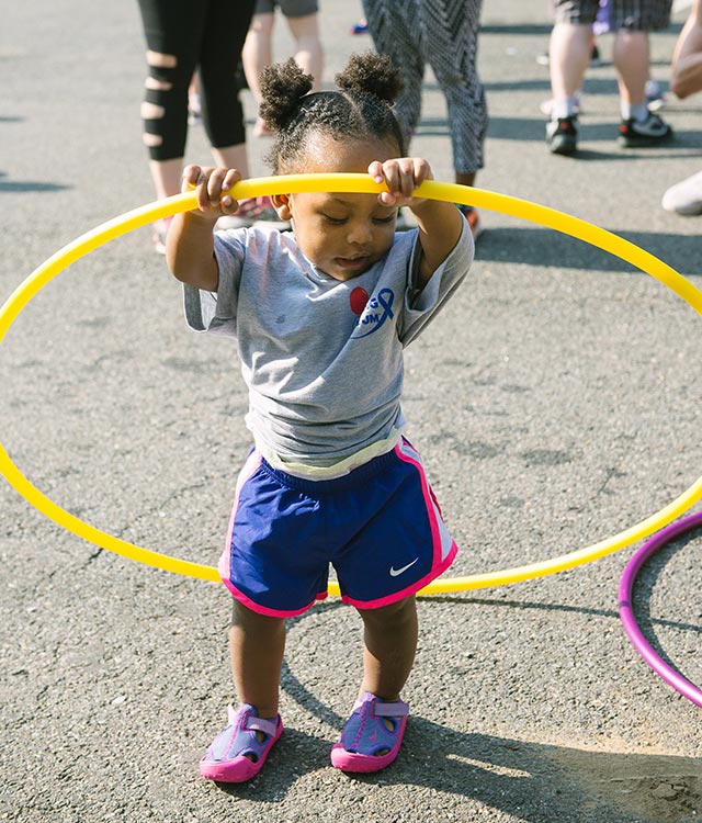 Toddler Girl at Walk with Hula Hoop