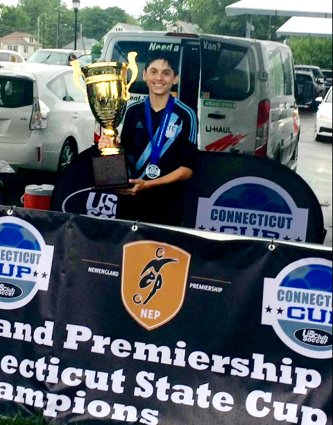 Luke holding Championship Trophy