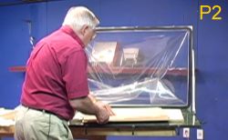 Placing sled for laminates in vacuum frame press