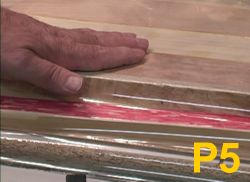 Sled for vacuum pressing laminates in press under full vacuum